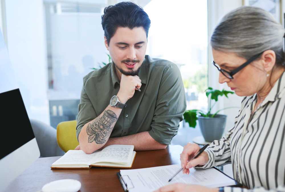 An editor and an author reviewing a manuscript together